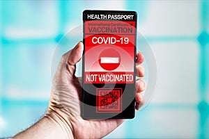 Phone with immunity passport software that certifies their non-vaccination against the COVID-19