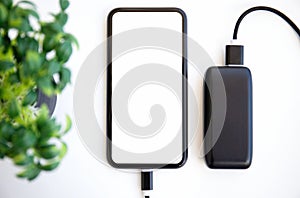 Phone with isolated screen is charged from the powerbank