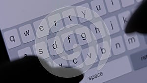 phone macro screen, on-screen keyboard, women's fingers type text, close-up