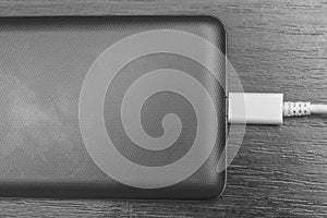 Phone photos charging on a gray background