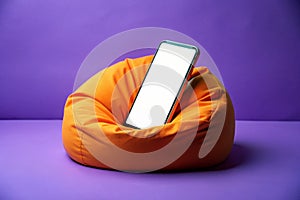 phone is propped up on an orange bean bag