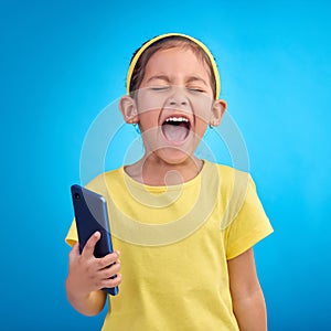 Phone, scream and child on blue background with attitude, upset and lose online game, network or internet. Technology