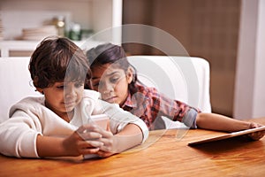 Phone, search and kid siblings with tablet in a kitchen for google it, gaming or bonding at home. Family, subscription