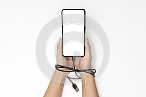 Phone security system with mobile phone in hand and charger cable on white background mockup