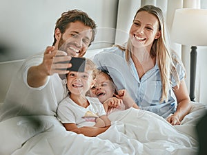 Phone selfie, family and relax in bed together bonding, smiling for mobile photograph for social media. Happy parents