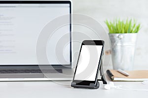 Phone showing white blank screen on work desk