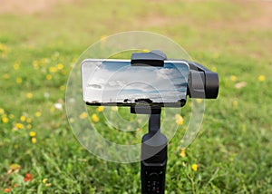 Phone on a tripod taking photo of usual rural England landscape in Yorkshire