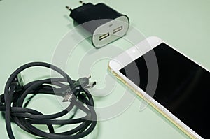 A phone with usb cable and block adapter