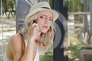 on phone while waiting for bus