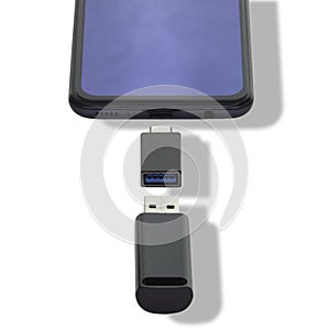 Phone on a white background data transfer via a universal USB flash drive adapter