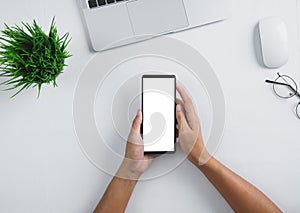 phone white screen in hand on white table