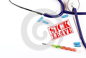 Phonendoscope and a sheet with the text sick leave on a white background