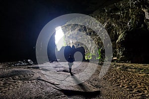 Phong Nha Ke national park / Vietnam, 15/11/2017: Woman entering the Hang Tien cave in the Phong Nha Ke national park in Vietnam photo