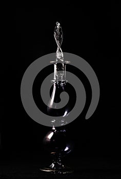 Phoography in a low key. perfume bottle on a dark background photo