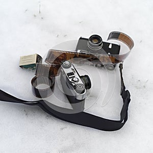 Phot cameras and film abandoned on the snow