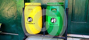 Photo of 2 different trash bins at school. for organic and non-organic