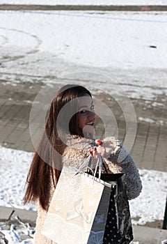 Photo 5. Happy young girl with black long hair. Shopping. 2022