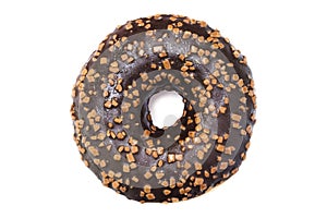 A photo from above of the single chocolate glazed donut with sprinkles isolated white background. Overhead donut photo from above