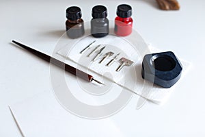 Photo of accessories for calligraphy and lettering on white tabl