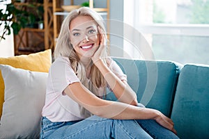 Photo of adorable gorgeous girl enjoying relax rest soft comfy sofa free time holiday morning at home indoors