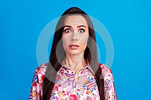 Photo of adorable impressed lady dressed print blouse big eyes isolated blue color background
