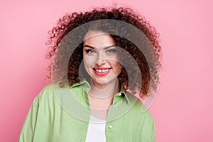 Photo of adorable positive cheerful woman with perming coiffure dressed stylish shirt toothy smiling isolated on pink