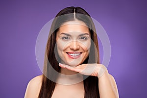 Photo of adorable pretty mature woman naked shoulders smiling arm chin isolated violet color background