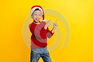 Photo of adorable small boy point empty space santa helper north pole dressed stylish red knitted look isolated on