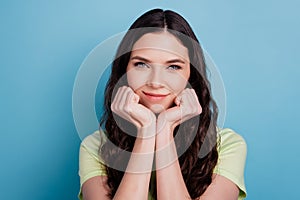 Photo of adorable sweet dream lady hands cheeks look camera on blue background