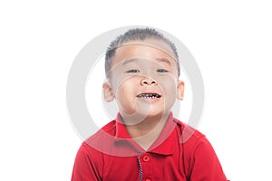 Photo of adorable young happy asian boy looking at camera