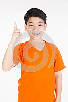 Photo of adorable young happy asian boy looking at camera