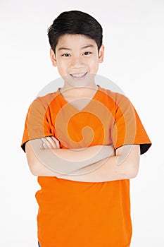 Photo of adorable young happy asian boy looking at camera