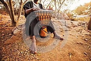 Photo of an african drummer playing