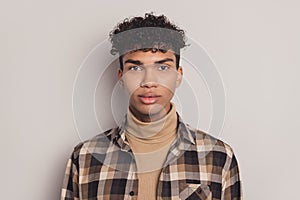 Photo of african guy wavy hairstyle look camera wear checkered shirt rollneck isolated grey color background