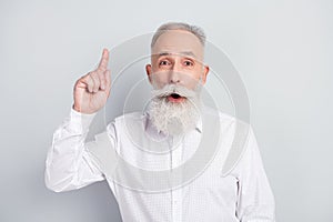Photo of aged man happy positive smile point finger genius idea plan decision isolated over grey color background
