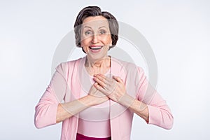 Photo of aged woman happy positive smile hands on heart appreciate grateful isolated over grey color background