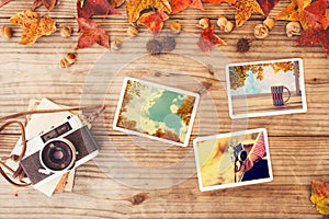 Photo album in remembrance and nostalgia in autumn fall season on wood table photo