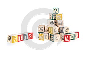 photo of a alphabet blocks spelling kids isolate on white background