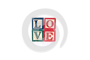 Photo of a alphabet blocks spelling LOVE isolate on white background