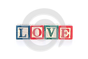 Photo of a alphabet blocks spelling LOVE isolate on white background