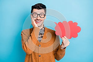 Photo of amazed happy young man hold cloud hand cheekbone wear plaid bow tie isolated on blue color background photo