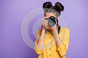 Photo of amazing dark skin lady holding photo digicam in hands photographing foreign sightseeing abroad wear yellow