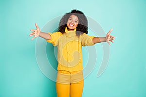 Photo of amazing dark skin lady with open arms waiting best friend coming for hugging wear yellow knitted pullover