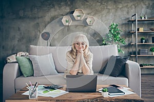 Photo of amazing white haired aged granny using notebook watching online masterclass business lecture lesson speaking