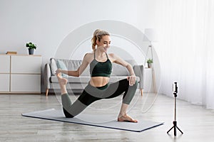 Photo of amazing young beautiful fitness woman make stretching exercises indoors at home