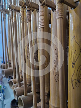 a photo of the angklung musical instrument, made of strung bamboo