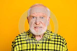 Photo of angry old man pensioner unhappy mad crazy conflict disagreement isolated over yellow color background