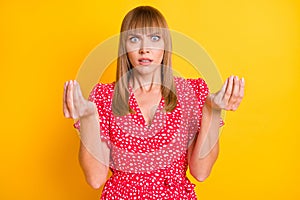 Photo of angry upset young woman make hands money sign bankrupt isolated on vivid yellow color background