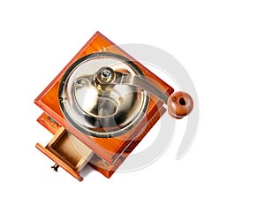 Photo of an antique coffee grinder on white