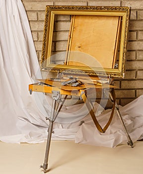 Photo of Artist tool box. Painter`s case with portable easel. Th